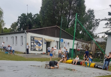 Relaxing at the Juvenia Rugby Club, Kraków. Wet slide.